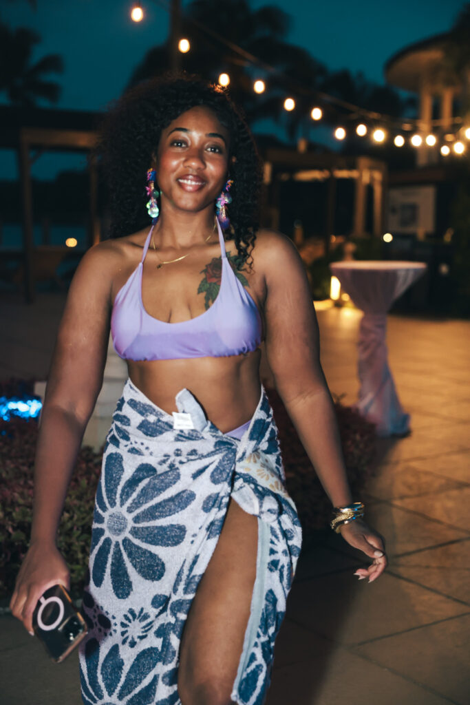 Poolside portrait at night under string lights