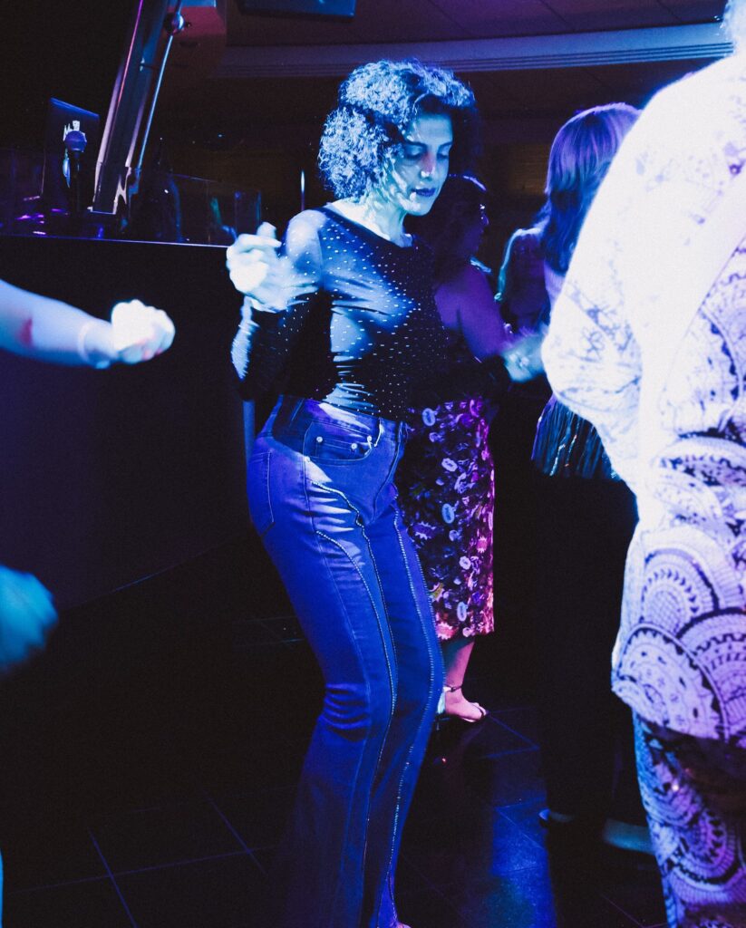 Dancing under blue club lights