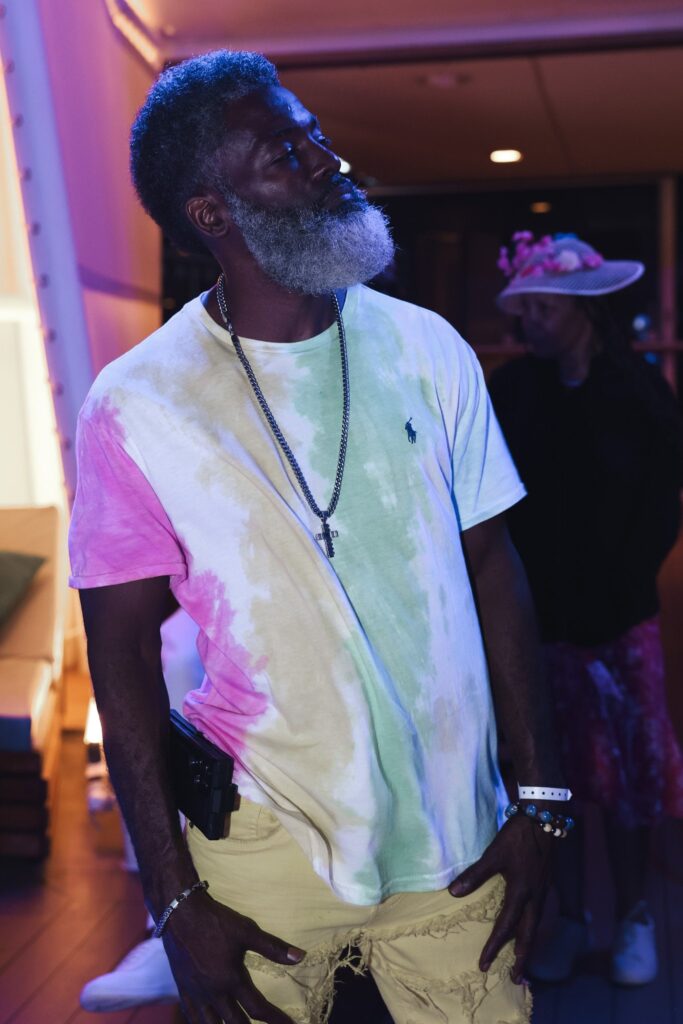 Portrait of a man in a tie dye shirt