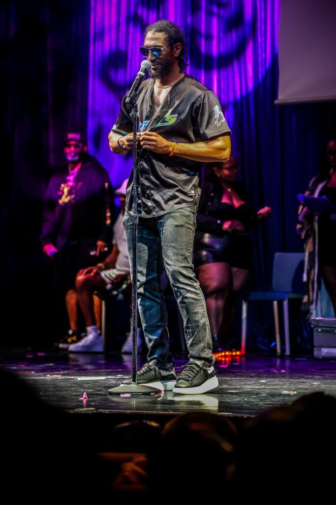 Performer at the mic on stage